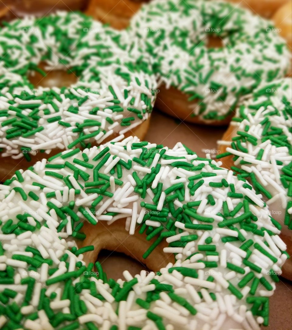 Donuts with white and green sprinkles