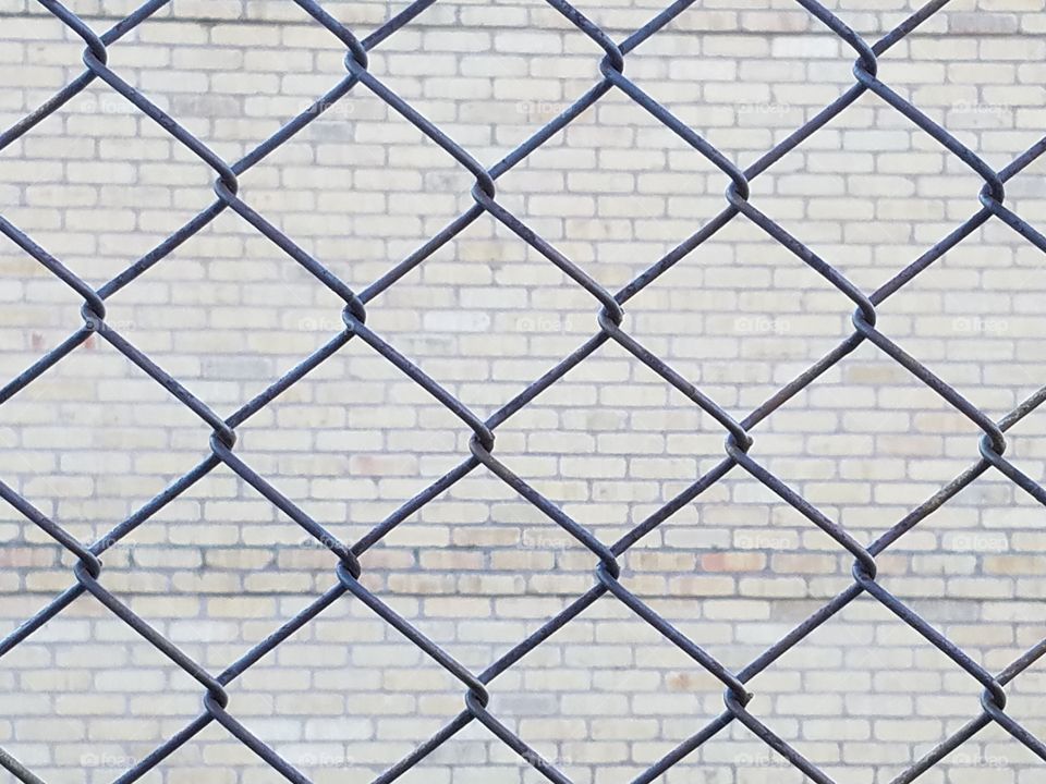 Fencing-In The Bricks