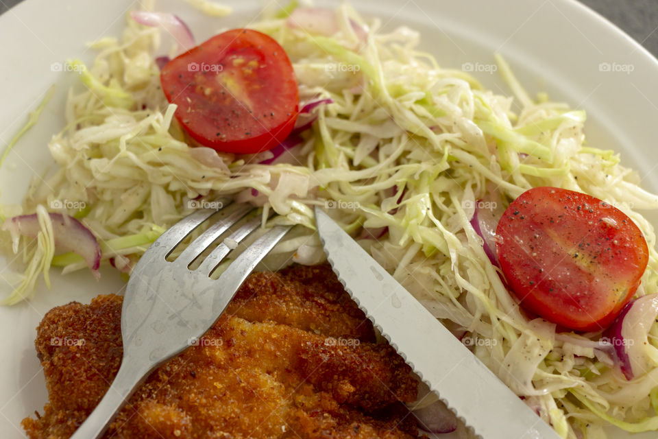 Breaded chicken and salad