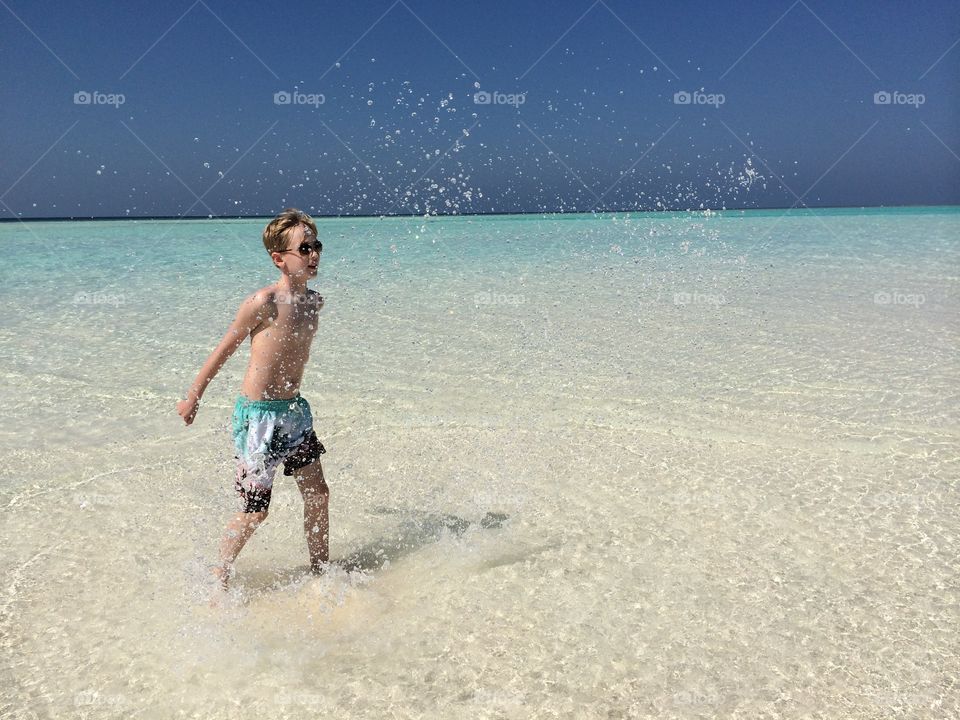 Boy enjoying in beach