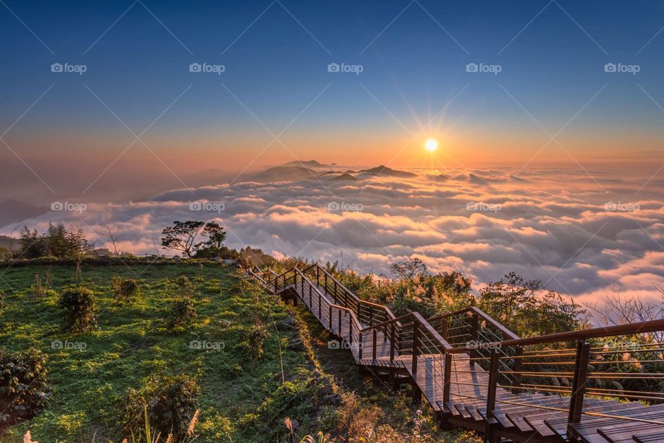 Beautiful mountain scenery with sea of clouds and sun set