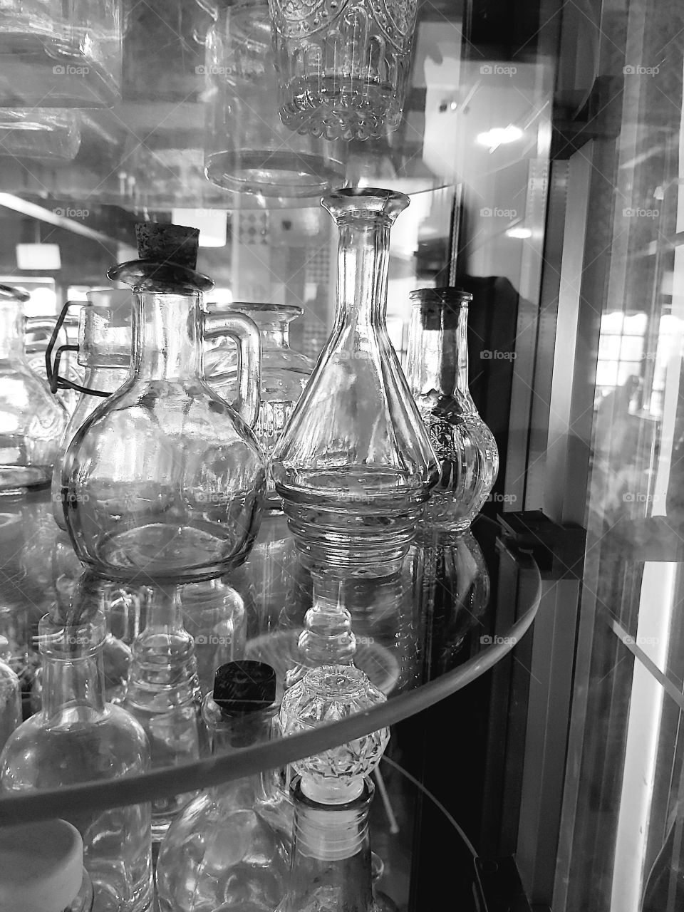 glass jars on a steel tray showing off a reflection
