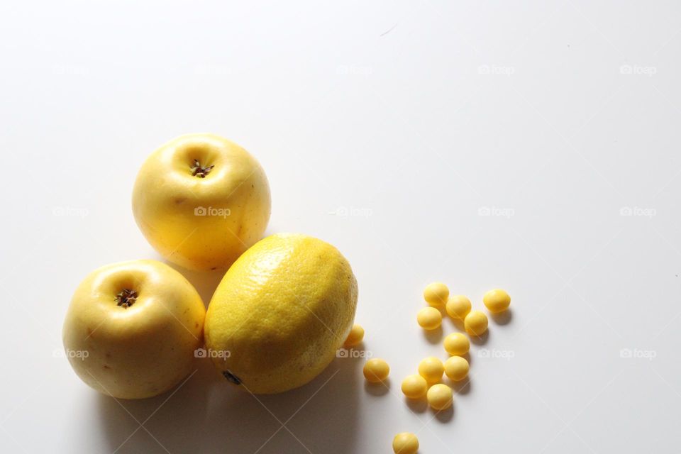 Yellow apples and lemon