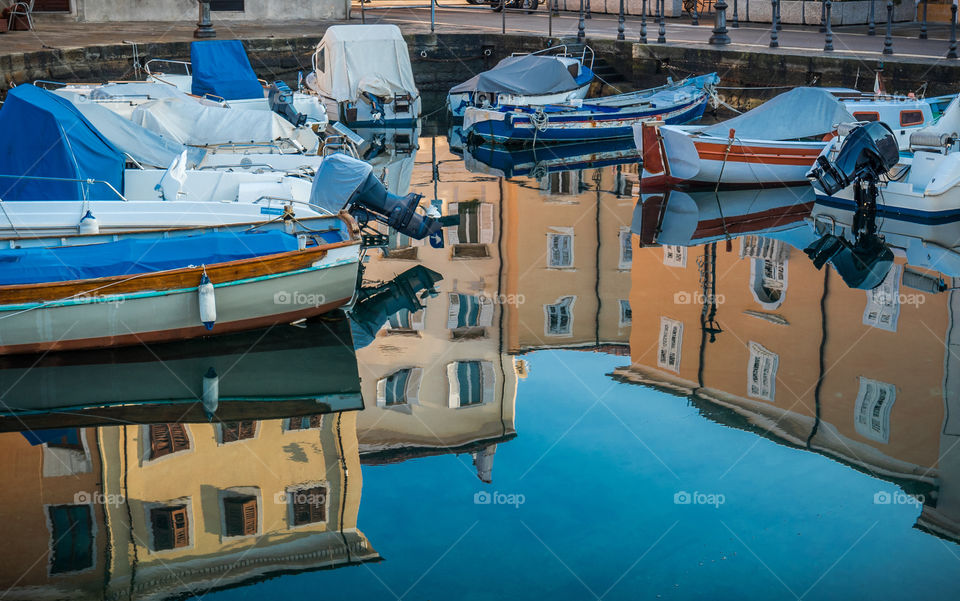 Boats moored in canal