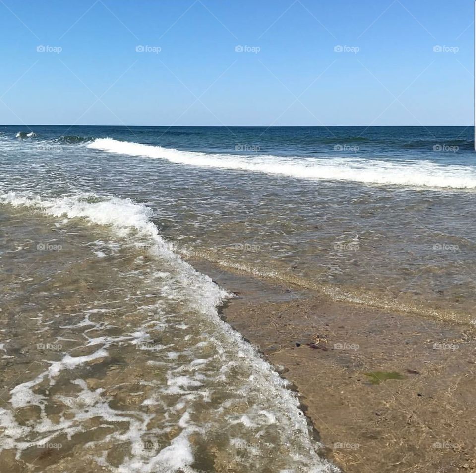 Shoreline at Cape Cod. Ocean Waves.