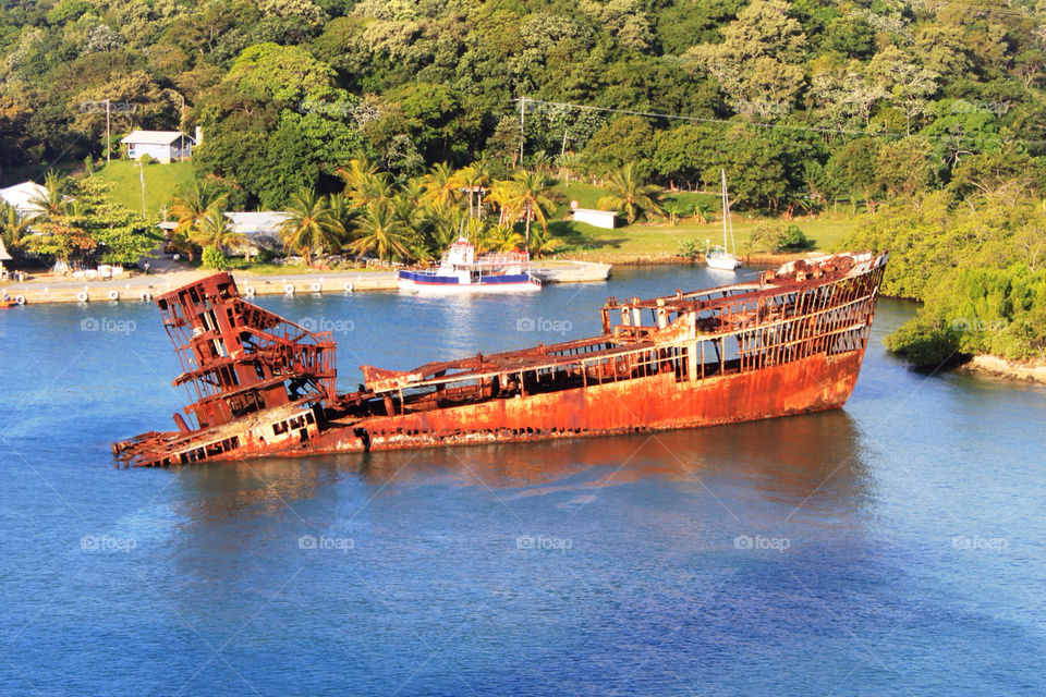 An old rusty shipwreck in Roatan, Central Amer.