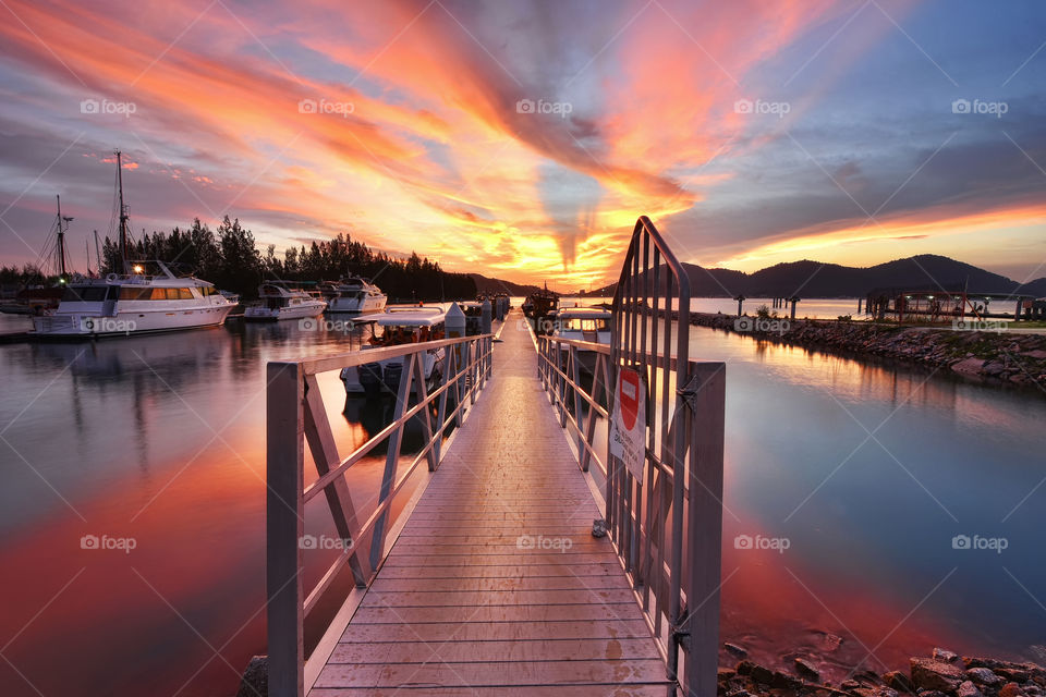 Sunset over the dock yard in Marina Island