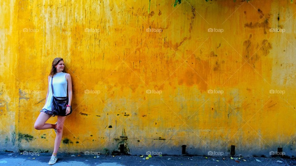 Girl at a wall