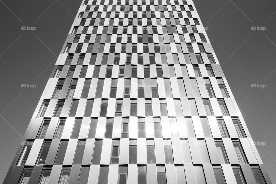 Sun reflection on modern high building in b&w