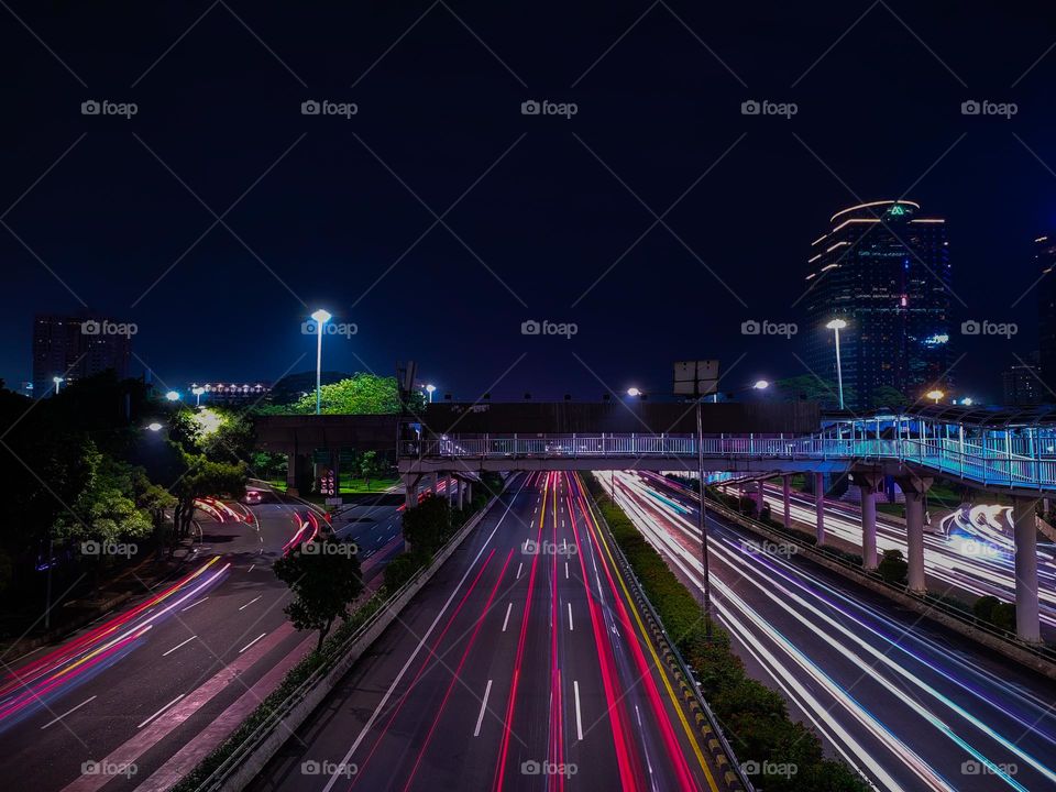 traffic lights in the city of Jakarta at night.