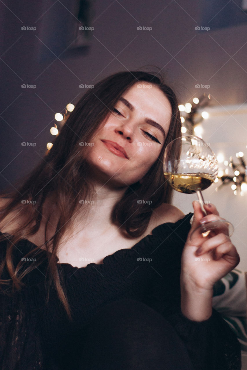 woman enjoying a glass of wine