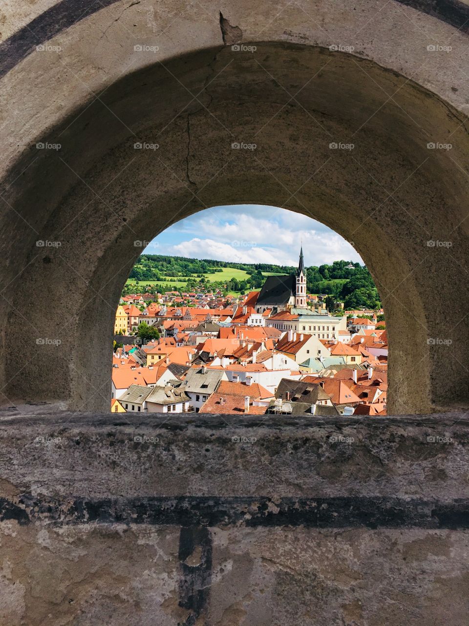 Cesky Krumlov, Czech Republic city through the hole in the wall 