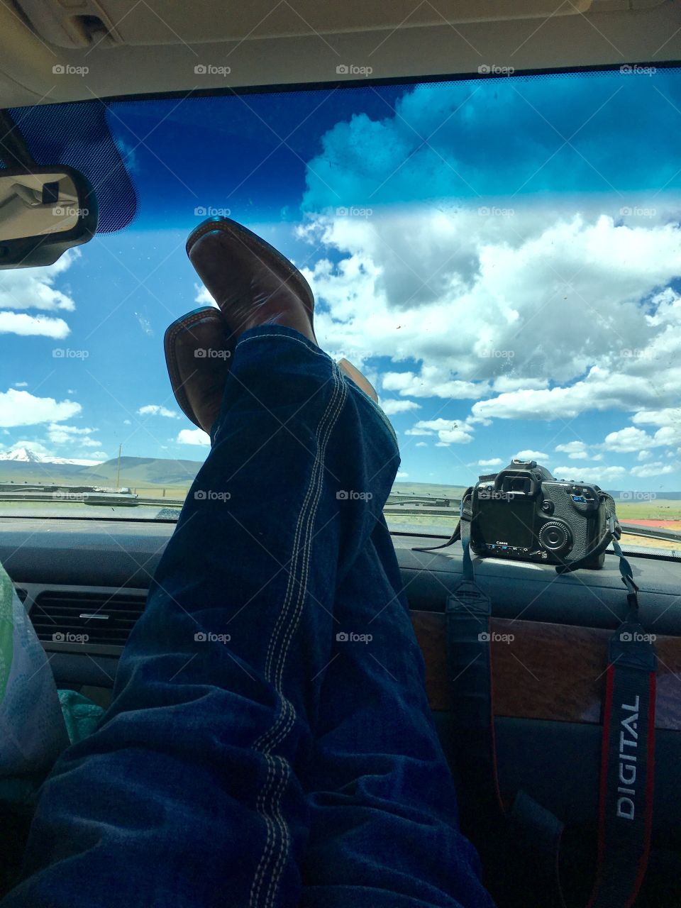 Relaxing time chilling in the wide country side. Taking a break from photographing the beautiful views of Wyoming. Me and my  Cannon taking a break. Kicking up the cowboy boots in the truck. Peaceful, relaxing way of life.