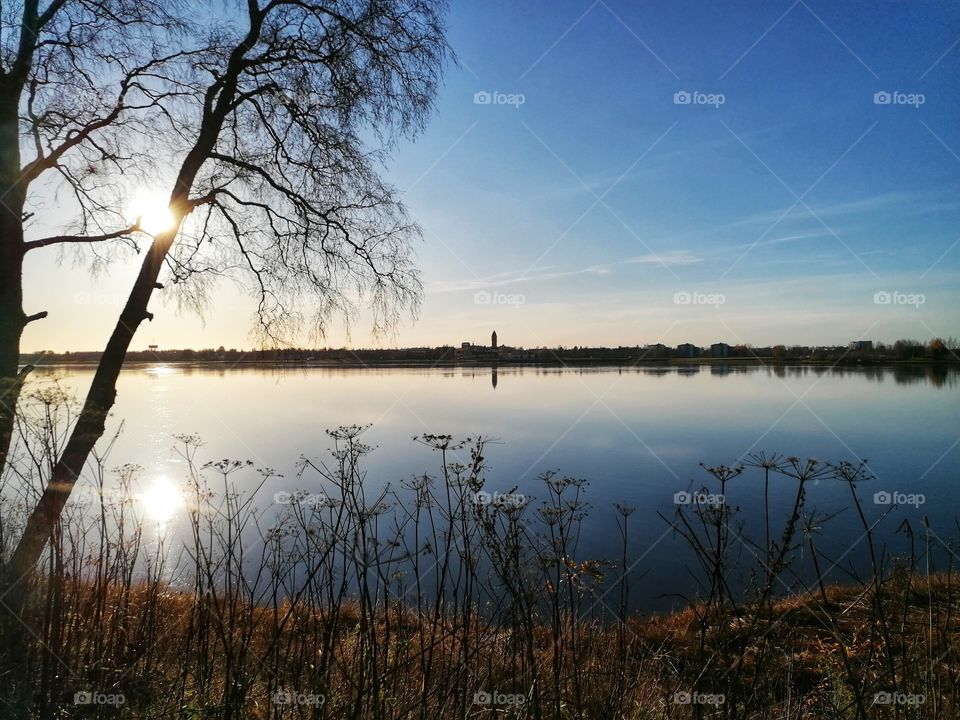 Great view on the Tornio River, Lapland, Finland in autumn. The Finnish-Swedish border is shown on the left.