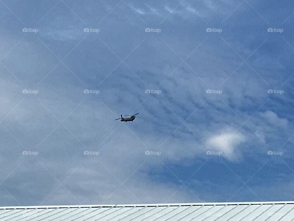 A whirlybird flying past probably going to the closest smallest airport near by.