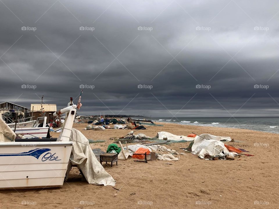 Fisherman’s beach under grey clouds