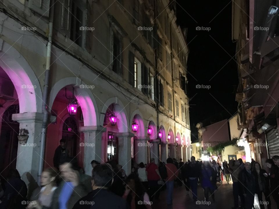 Good Friday purple lights, street scene in Corfu Town by Night