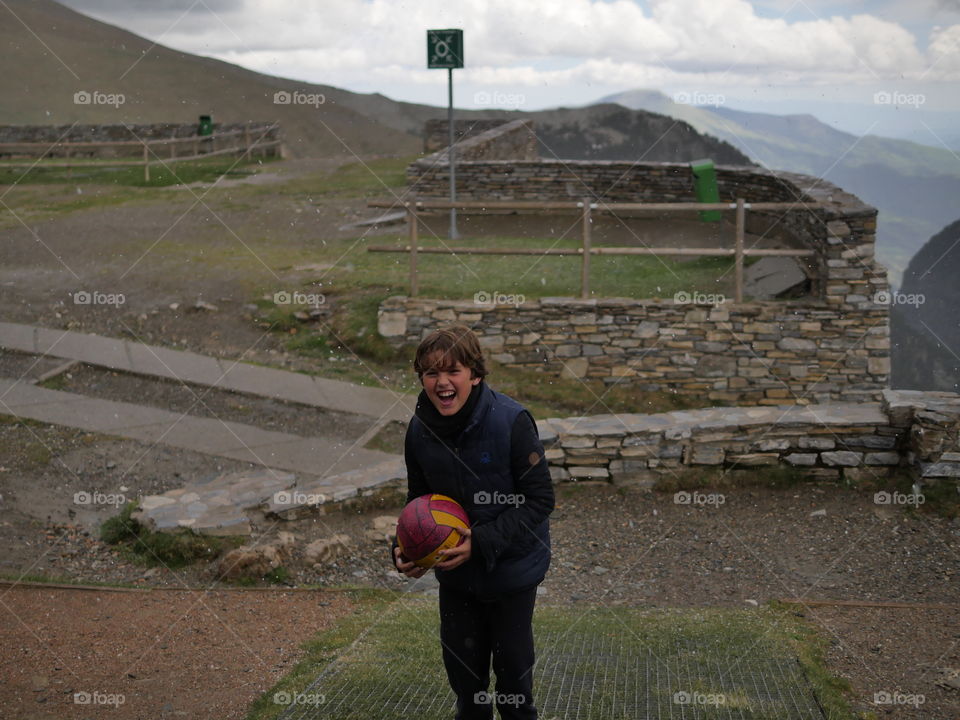 Child holding football in hand