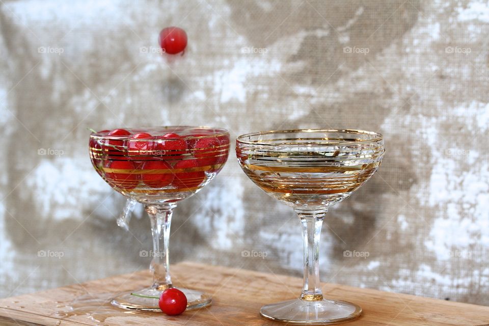 red cherry and two champagne glasses