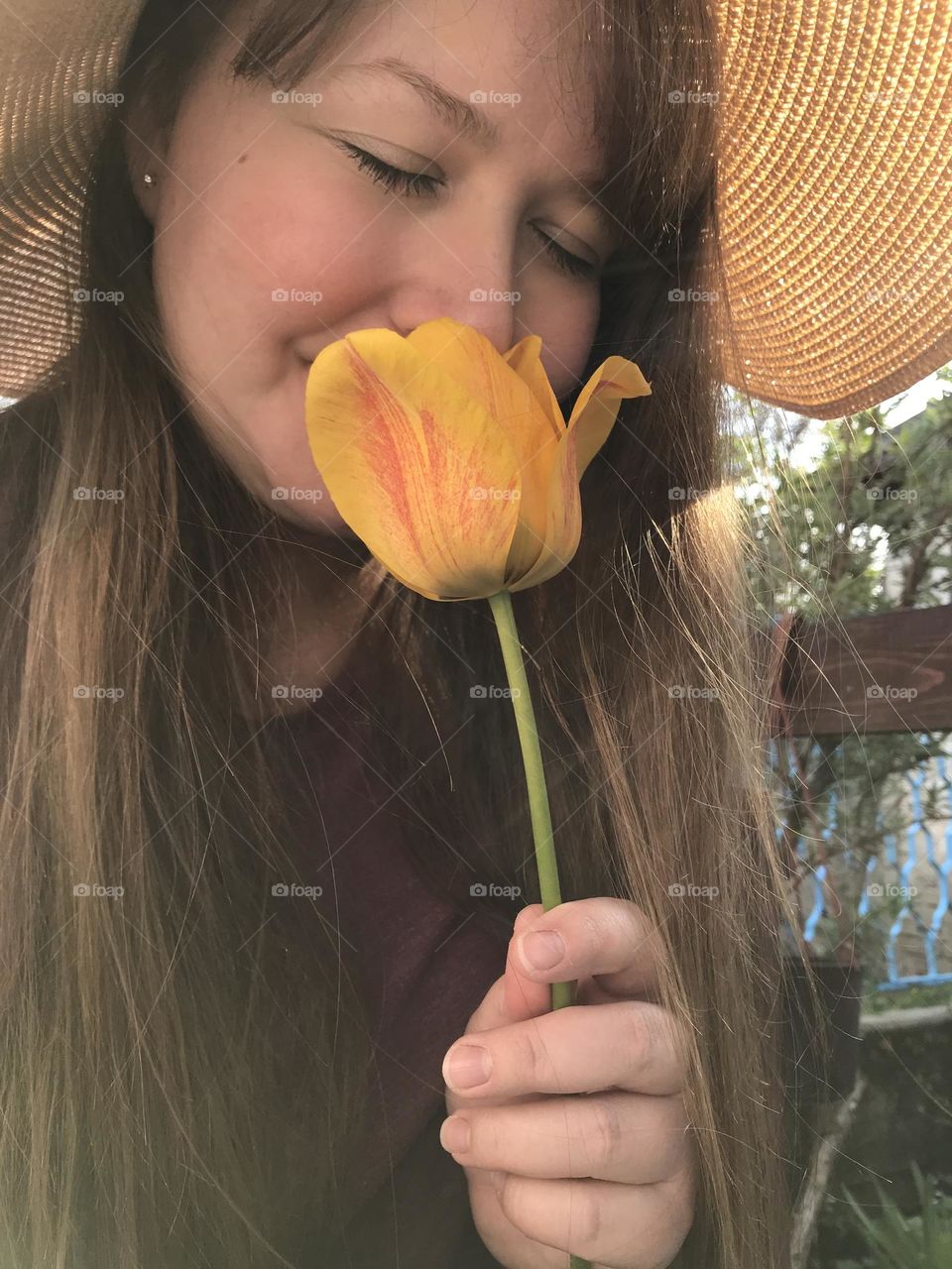 A girl with yellow tulip