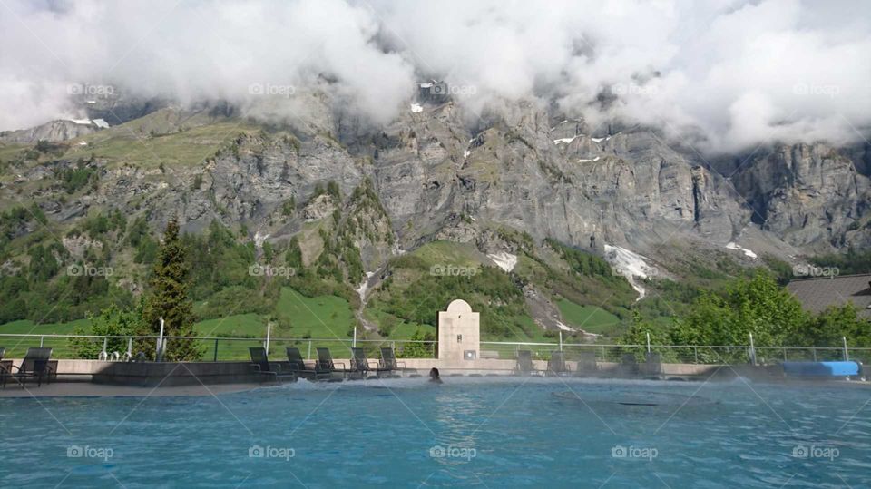 Thermal Baths, Leukerbad, Switzerland. Spectacular view, tranquility entering your soul. Surrounded by the Alps, picturesque clouds, with the snow peaking through to complete your sense of euphoria. 