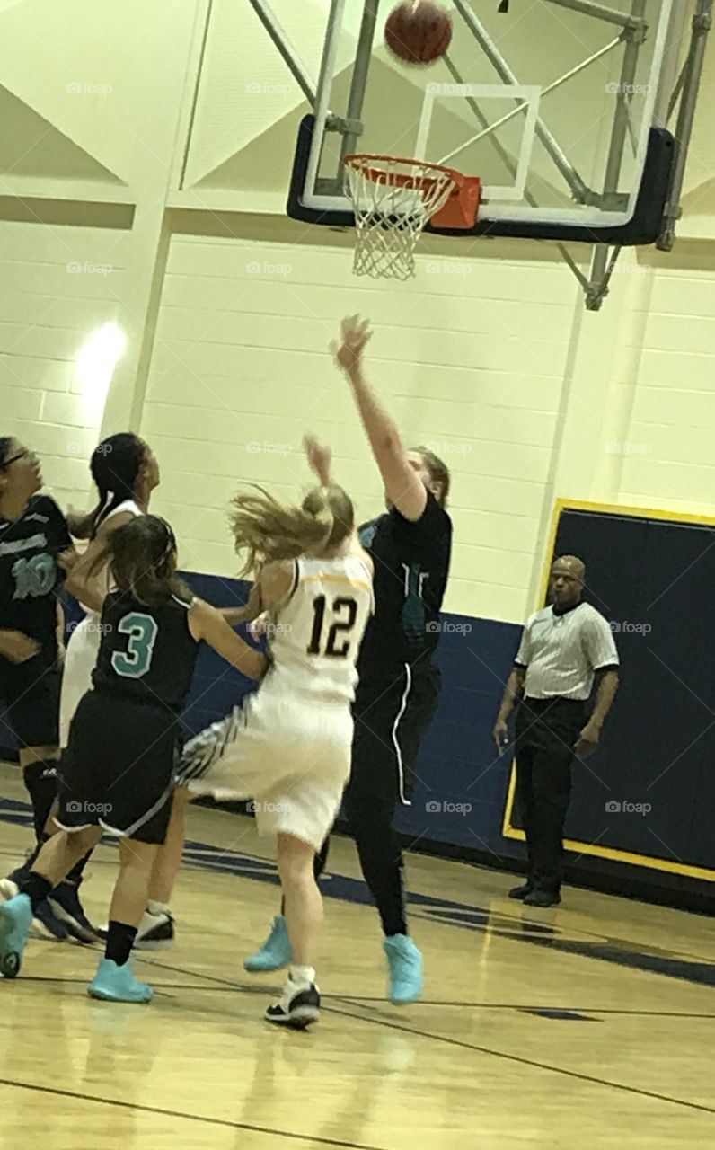 This is my sister playing at her high school on her basketball team. 