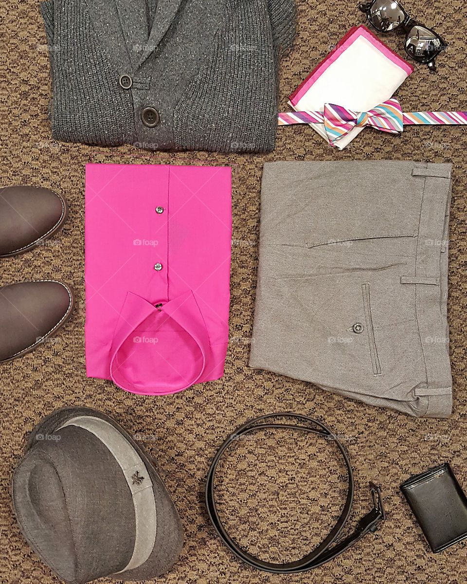 A mens business fashion flat layout with a bright pink shirt