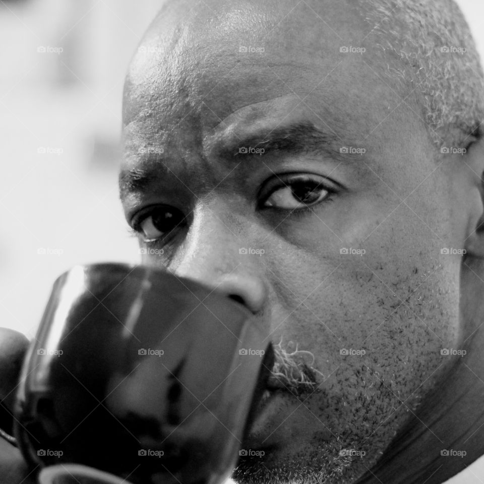 Portrait of a man drinking coffee