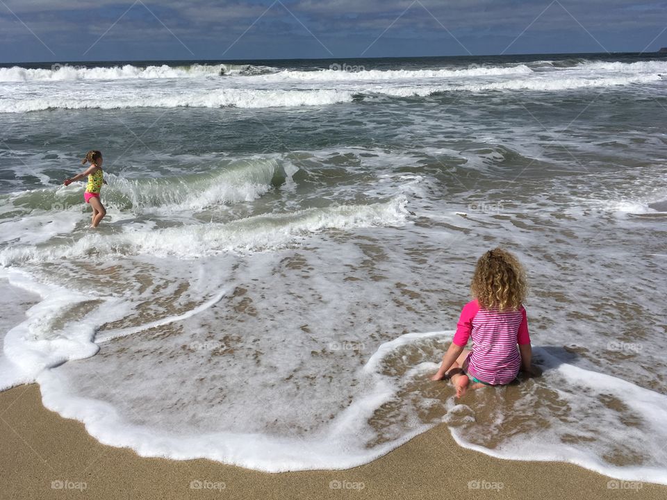 Playing in the ocean at half moon bay.