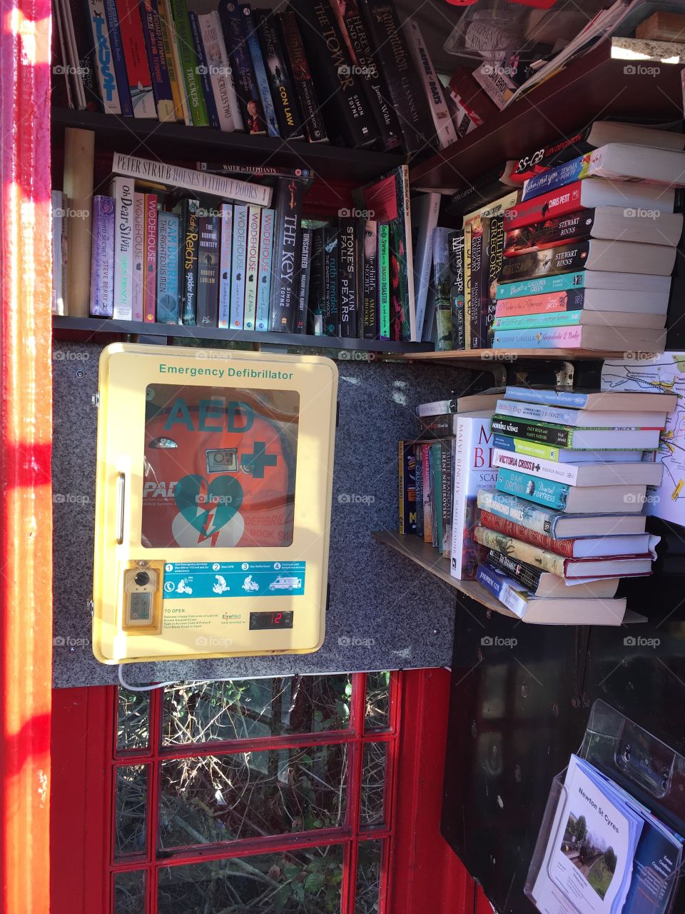 Alternative use for a telephone box, a medical purpose and a book library.