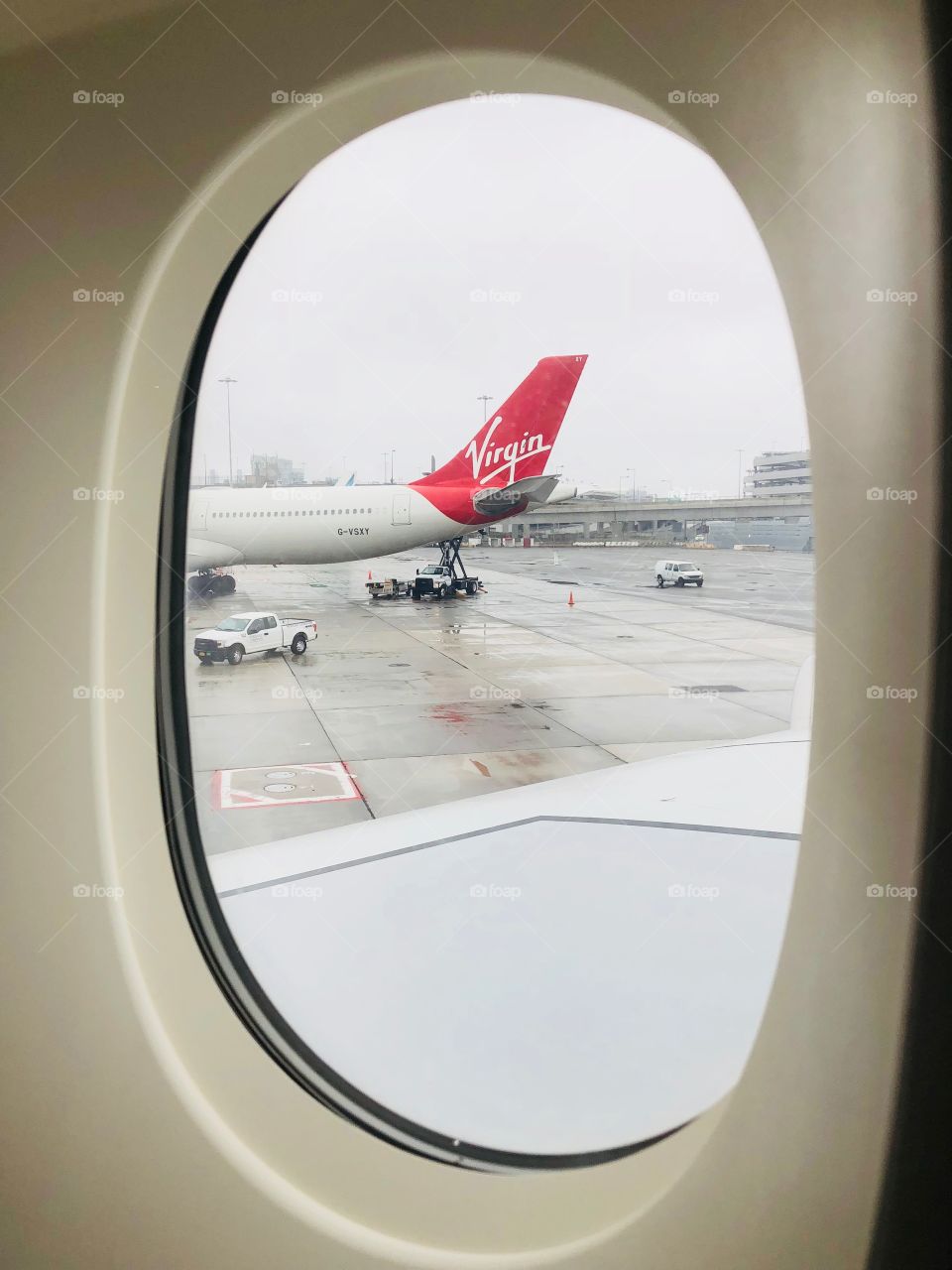From the glass ! Virgin ! Virgin airline ! Co-plane ! Taken by iPhone X