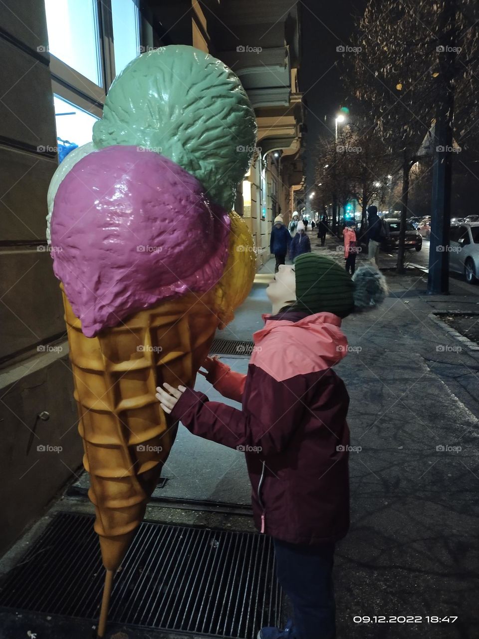 A hungry child and a huge ice cream