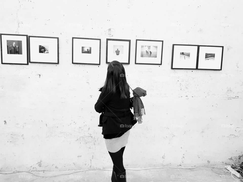 girl viewing m monochrome photography exhibition