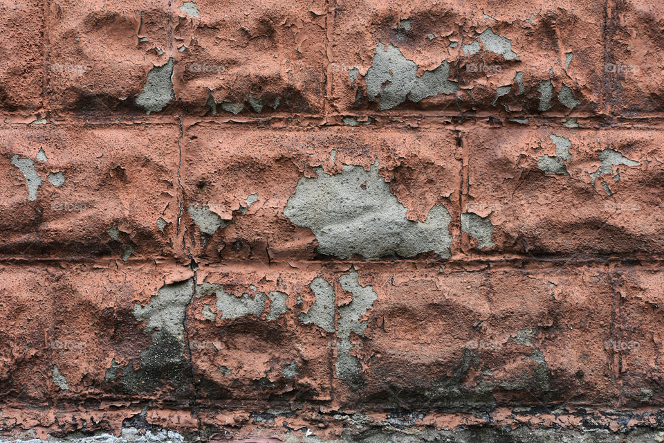 Stone wall with peeling paint