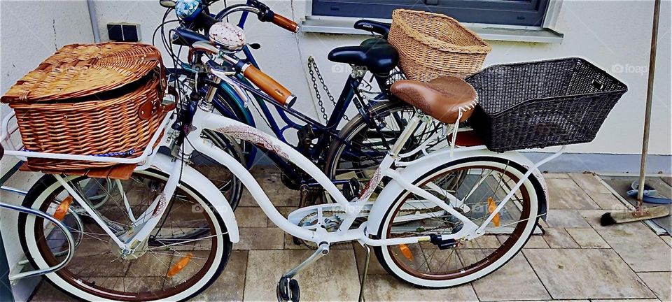 These are three bicycles outside a house in “Bavaria”, Germany, the white one up front being the newest and recently purchased. 2024. Hypnotic Productions