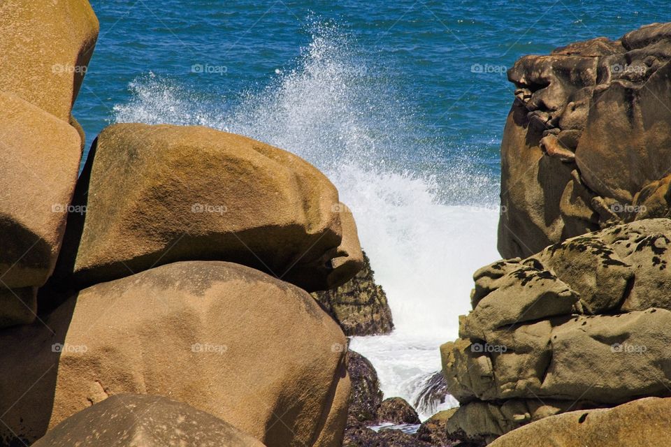 waves crashing on rocks