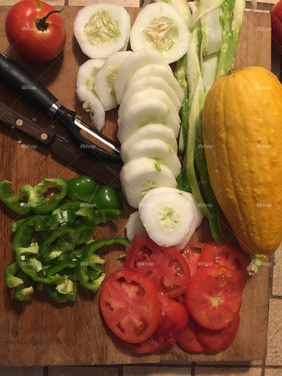 Squash, green peppers, tomatoes and cucumbers for tonight's hamburgers for supper