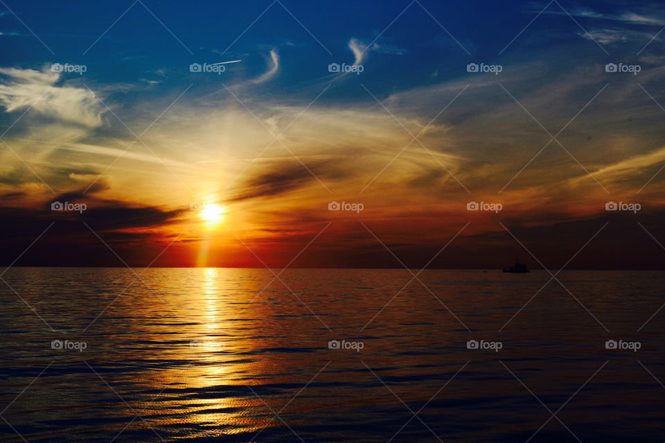 Orange blue baltic sky. Working on a windfarm in the baltic, this is the rewarding view.