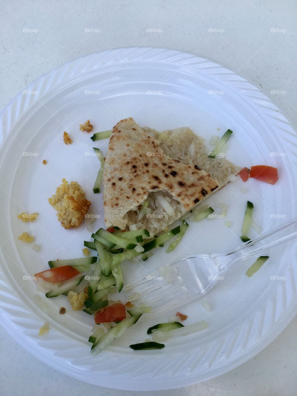 Plastic plate with pita falafel salad