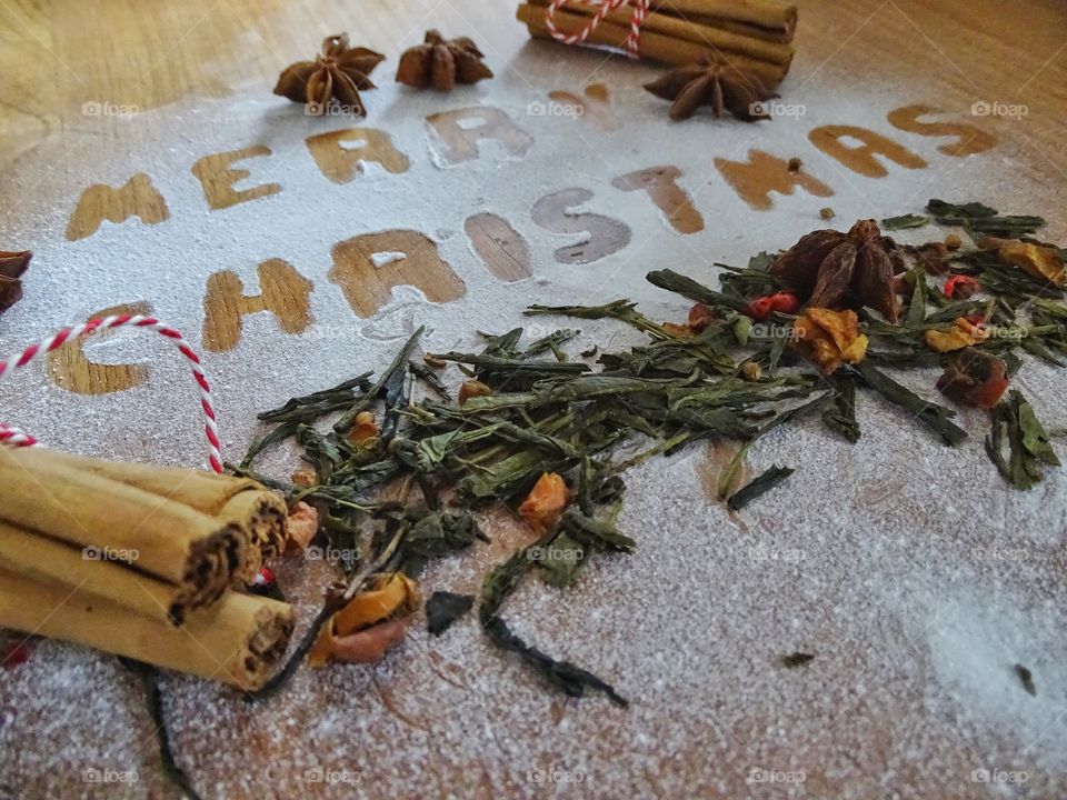 Writing merry christmas with powdered sugar