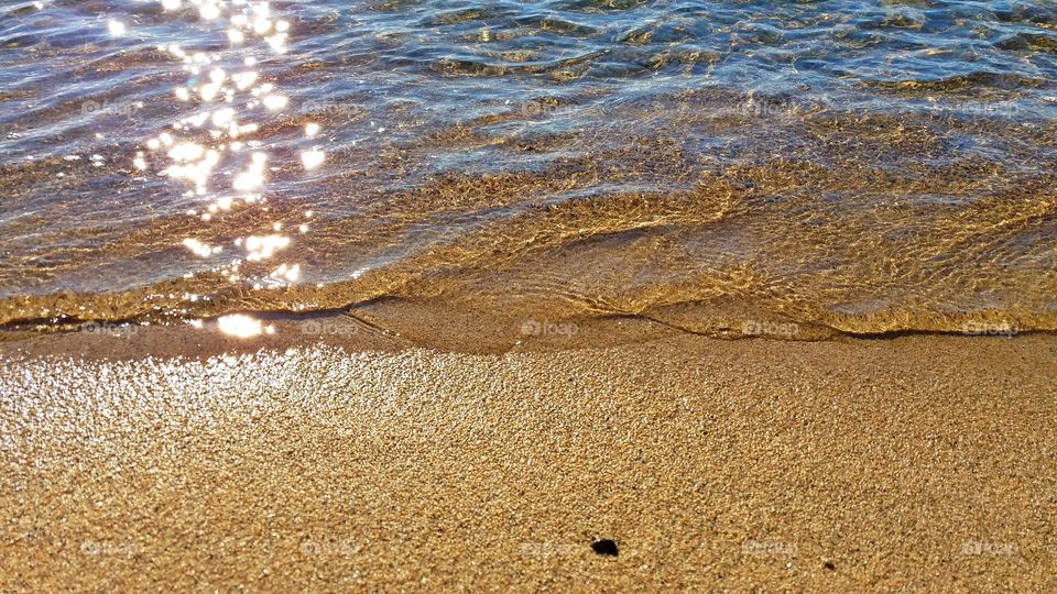 Sandy beach and tide