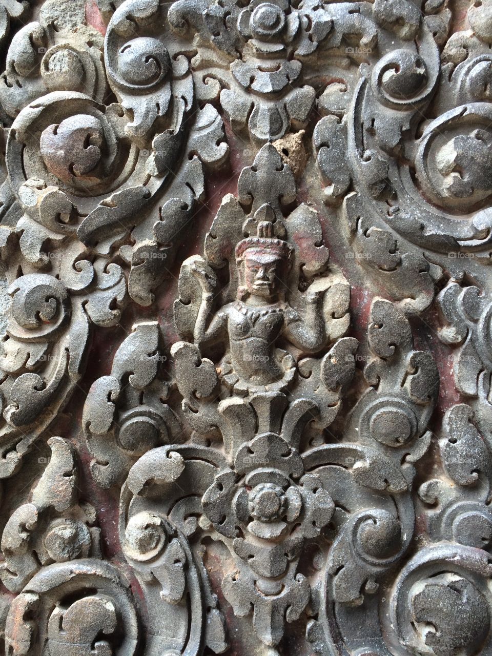Decoration on a temple wall in Angkor, Cambodia.