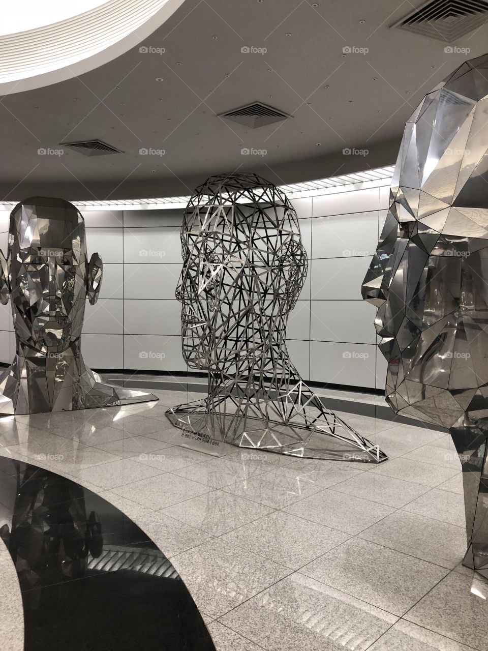 A silver talking heads installation in the subway to keep you entertained and talking. Reflective of all of us, so meaningful yet beautiful. 