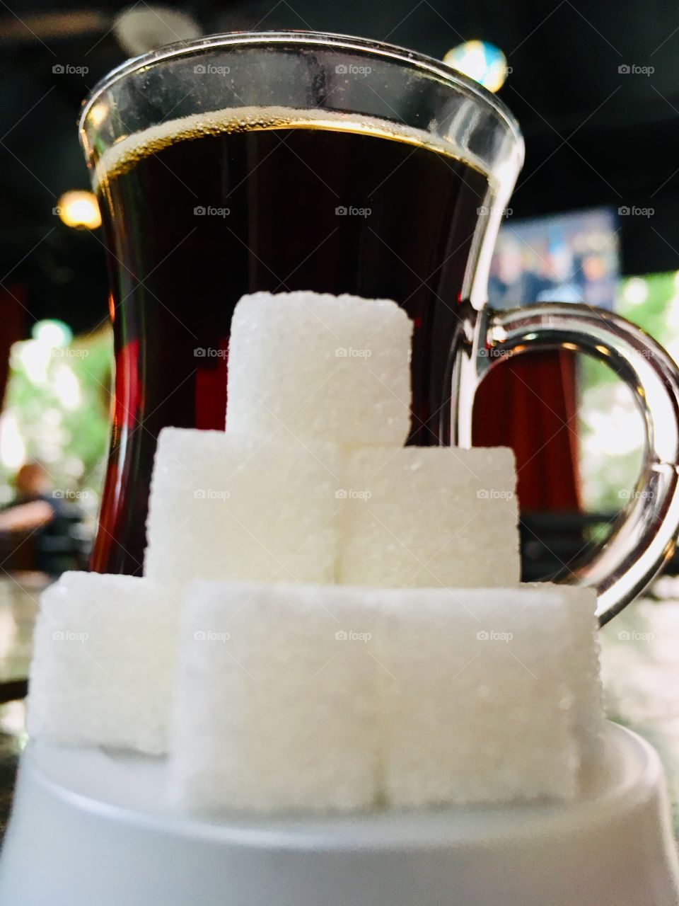 Pyramid of sugar cubes and turkish tea