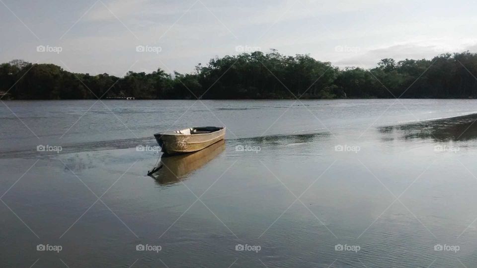 Small Fisher boat in Black River in Peruíbe BR