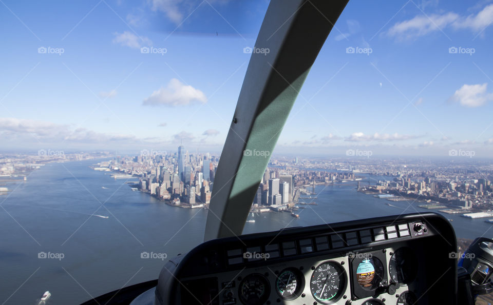 Helicopter ride over river, view over Manhattan 