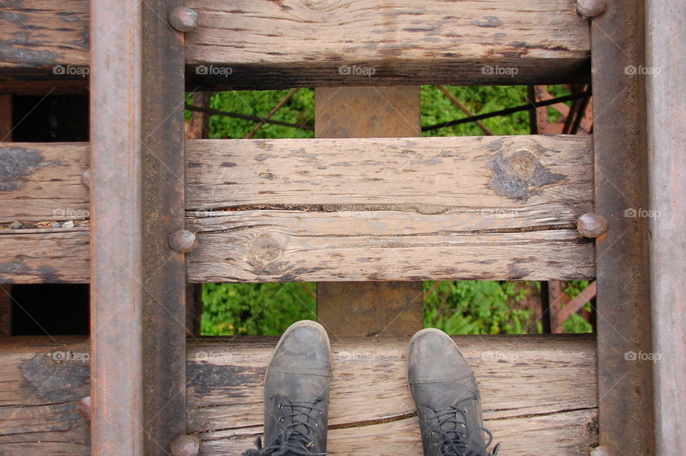 Picture of feet on trestle in Victoria, BC.