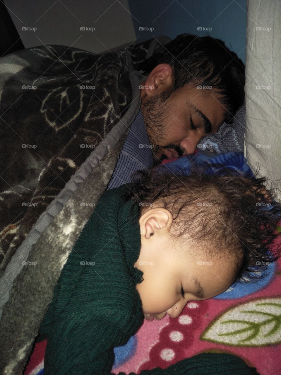 sleeping baby with father