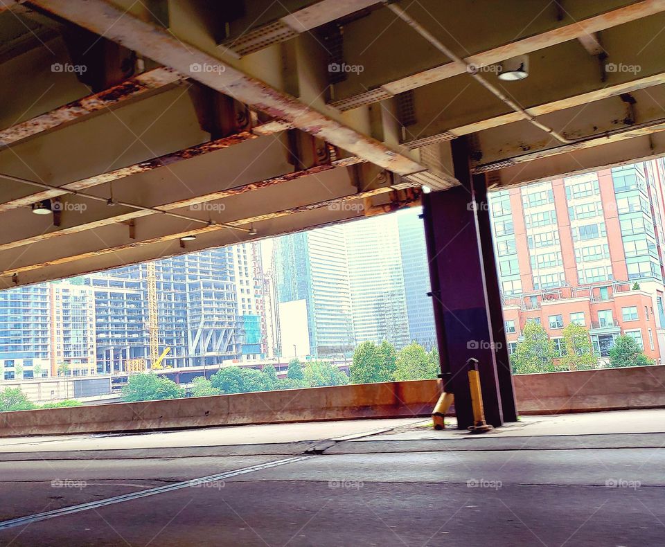 Looking at the skyscrapers im Chicago from under an overpass