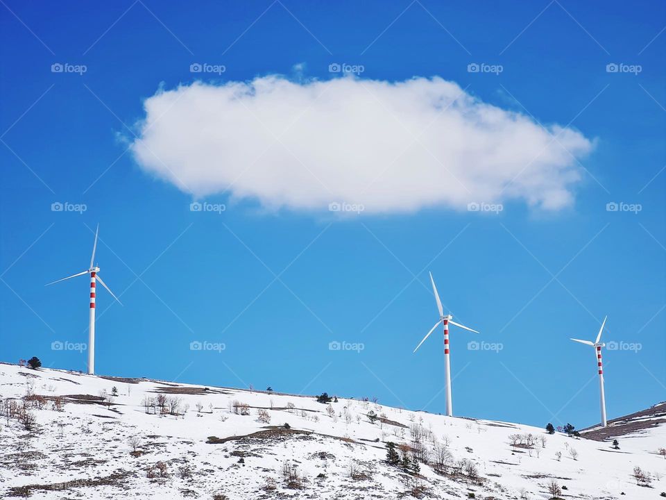 wind turbines on the snowy mountain